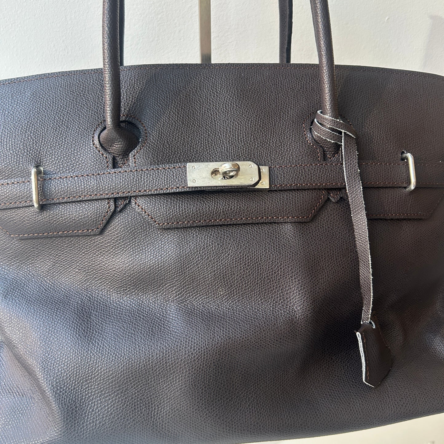 Brown leather firkin bag