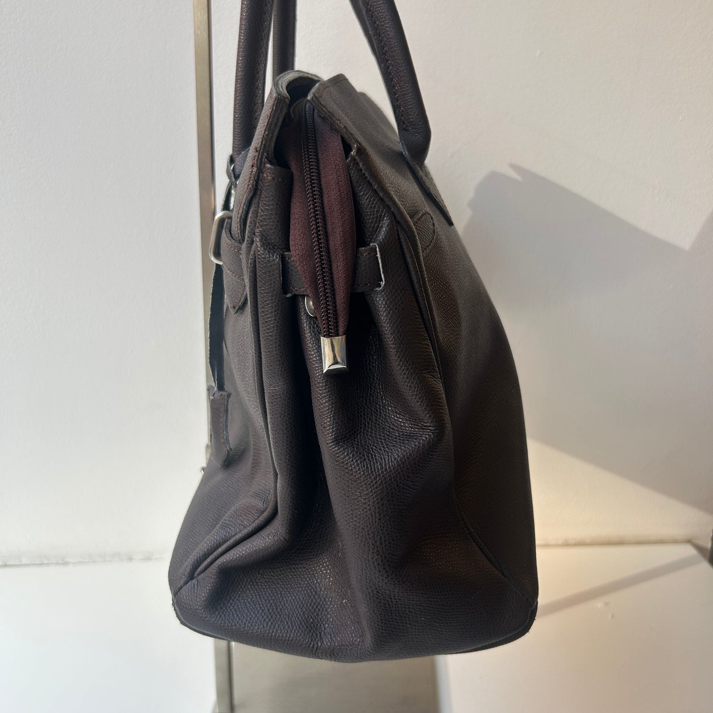 Brown leather firkin bag